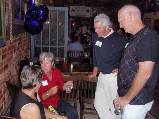 Peggy (red) and Jim Grow talk with Ron and Cheri Patterson