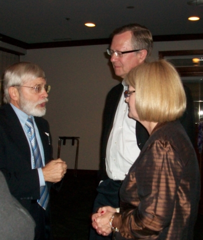 Dan Seitz of Odenon MD, talks with Dave Dubicki of Peoria IL and Joan McGrath of St. Charles IL