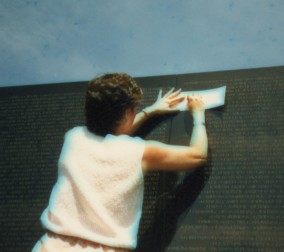 Making a rubbing of a name on the Wall