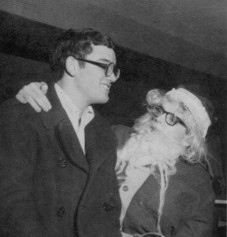 Christmas: Rick Pilon is overwhelmed with the attention from Santa (alias Tom Theado.)
